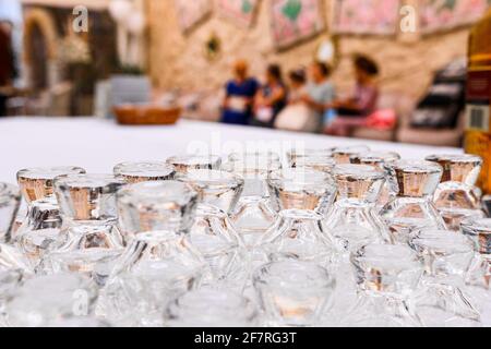 a set of glasses for drinking,glasses in a row and top upside down. new Stock Photo