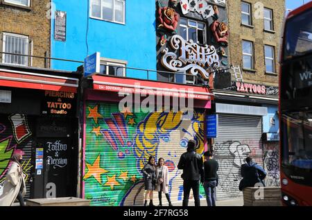 London, UK, April 9th 2021. Shop owners on colourful Camden High Street getting ready to reopen on April 12th, the next big date in the government cornavirus roadmap. Monica Wells/Alamy Live News Stock Photo