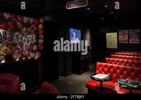Horizontal view of the interior of the AKAB48 Cafe dedicated to the AKAB48 Japanese idol group, Akihabara, Tokyo, Japan Stock Photo