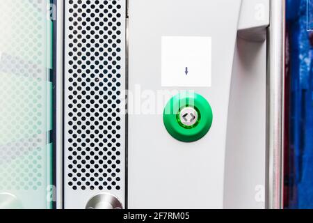 Button opening the door of a modern electric train stadler, close up. Stock Photo