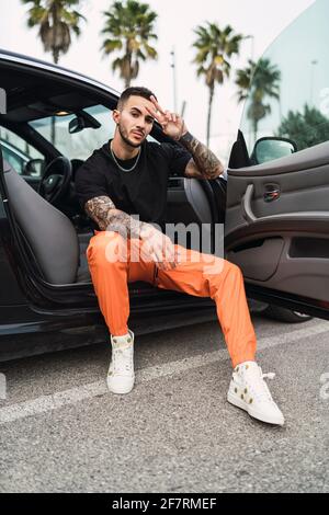 Indian Man At Casual Wear Posed Near White Car. Stock Photo, Picture and  Royalty Free Image. Image 131317083.