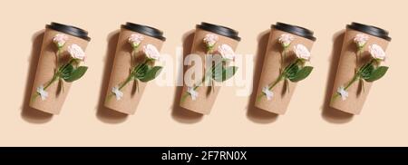 reusable eco coffee or tea cup with rose pattern on beige background. Sustainable lifestyle. Eco friendly and Zero waste concept. mock up. banner Stock Photo