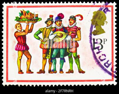 MOSCOW, RUSSIA - JANUARY 17, 2021: Postage stamp printed in United Kingdom shows 'The Boar's Head Carol', Christmas 1978 - Carol Singers serie, circa Stock Photo