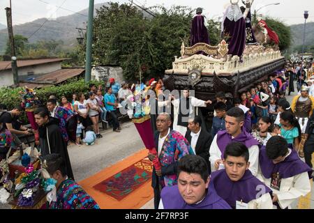 Intricate and vibrant sawdust alfombras decorate the cobblestone streets of Antigua, Guatemala in preparation for the Semana Santa processions. Stock Photo