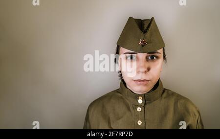 1936 year. A man in a military uniform of the Red Army gives a flower to  his wife. Woman in an elegant dress Stock Photo - Alamy