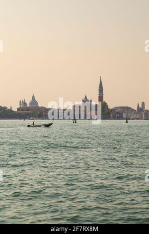Approaching Venice in Italy at dusk by vaporetto or water bus. Stock Photo