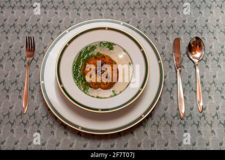 Kaspressknoedelsuppe, Beef Broth with Cheese Dumpling, a Traditional Soup from Western Austria Stock Photo