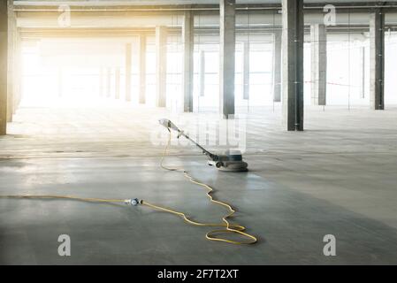 floor polishing machine inside a large industrial building, not people Stock Photo