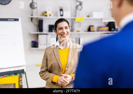 Project managers and employees brainstorming on ideas - Multi-ethnic group of workers having business meeting in a start-up office Stock Photo