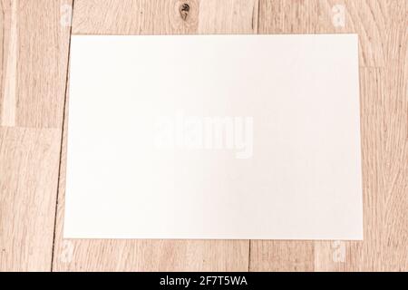 A4 paper card on the floor with panels, copyspace Stock Photo