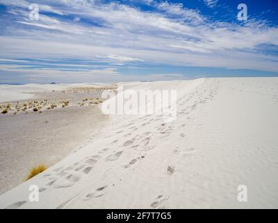 Footprints along the sand dunes at White Sands National Park, New Mexico, Stock Photo
