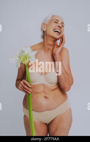 Beautiful senior woman with young and clean look, beauty shot - Pretty senior  lady over 60 with perfect skin, concepts about elderly, beauty treatment  Stock Photo - Alamy