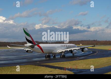 Düsseldorf, Germany - February 24, 2007: Airbus A340-313X of Emirates at the airport of Düsseldorf reaching the runway after taxiing Stock Photo