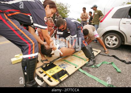 porto seguro, bahia / brazil - december 30, 2010: Samu rescuers service a motorcyclist involved in an accident on the BR 367 highway in Porto Seguro. Stock Photo