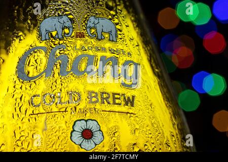 BANGKOK, THAILAND, MAY 15 2020, The dewy bottle of Chang brand beer, close up, the colored lights on a background. Stock Photo
