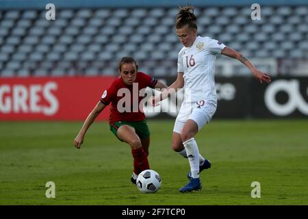 Lisbon, Portugal. 9th Apr, 2021. Ekaterina Pantyukhina of Russia (R ) vies with Joana Marchao of Portugal during the UEFA Women's EURO 2022 play-off first leg match between Portugal and Russia, at the Restelo stadium in Lisbon, Portugal, on April 9, 2021. Credit: Pedro Fiuza/ZUMA Wire/Alamy Live News Stock Photo