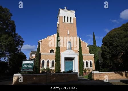 St Kevin's Catholic Church in Ormond, with new signage, bathed in sunlight Stock Photo