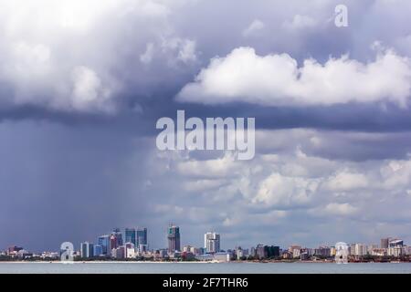 March, 20, 2020 - Dar Es Salaam, Tanzania: panorama of Dar Es Salaam from the water under a stormy sky Stock Photo