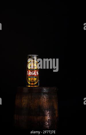 BUCHAREST, ROMANIA - Mar 29, 2021: Can of Argus beer on beer barrel with dark background. Illustrative editorial photo Bucharest, Romania, 2021 Stock Photo