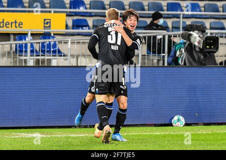 Bielefeld, Germany. 9th Apr, 2021. Okugawa Masaya (R) and Arne Maier of Bielefeld celebrate an own goal of Freiburg during a German Bundesliga match between Arminia Bielefeld and SC Freiburg in Bielefeld, Germany, April 9, 2021. Credit: Ulrich Hufnagel/Xinhua/Alamy Live News Stock Photo