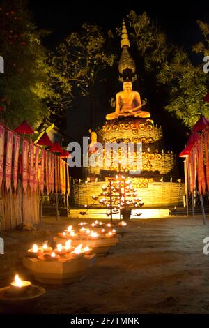 Candle on the street lead to buddha statue in Makha bucha day, chiang mai, thailand. Stock Photo