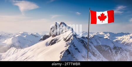 Canadian National Flag Overlay. Mountain Landscape in Winter. Stock Photo