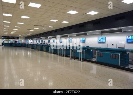 Empty and closed ticket counters at the Miami International Airport, Friday, April 9, 2021, in Miami. Stock Photo