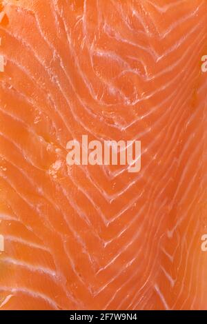 Smoked salmon slices close up full frame as a background Stock Photo