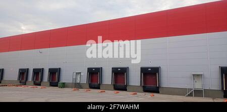 Warehouse complex. Logistic complex for storage and transportation of goods. Unloading and loading of goods. Cargo transportation. Stock Photo