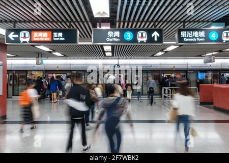 HongKong, China - November, 2019:  People using subway train at  MTR station / metro train station in HongKong Stock Photo