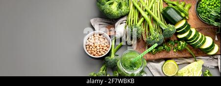 Set of various green vegetables and fruits like cabbage, broccoli, asparagus, peas, Brussels sprouts, zucchini, peppers, garlic, beans, pak choy, lime Stock Photo