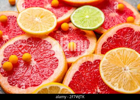 Vitamin C pills and citrus fruits slices, closeup Stock Photo