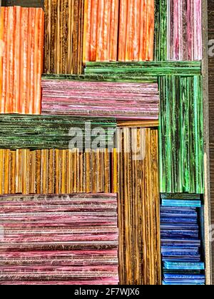 Colorful pieces of stained glass stack in a box Stock Photo
