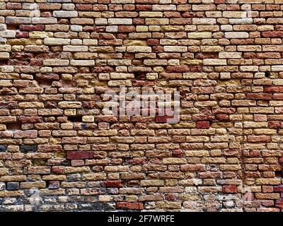 Horizontal part of a Venetian old red brick wall, background, Stock Photo