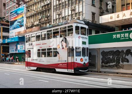 Hong Kong - November, 2019:  Famous historic double-decker tram car on the street of Hong Kong Island Stock Photo