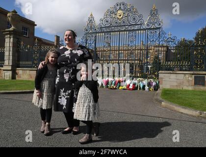 Naomi Armstrong-Cotter and her daughters Lillie, 6, (left) and Essie, 5, after laying flowers at the gates of Hillsborough Castle in Northern Ireland, following the announcement of the death of the Duke of Edinburgh at the age of 99. Picture date: Saturday April 10, 2021.