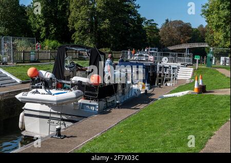 River cruisers passing through Temple Lock between Hurley and Marlow on the River Thames in Buckinghamshire, Britain Stock Photo