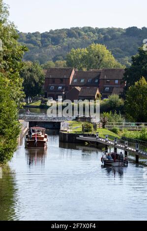 Riverboats approaching Temple Lock between Hurley and Marlow on the River Thames in Buckinghamshire, Britain Stock Photo