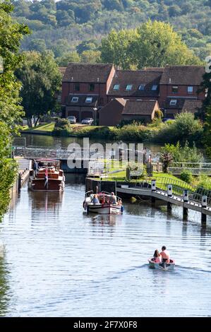 Riverboats approaching Temple Lock between Hurley and Marlow on the River Thames in Buckinghamshire, Britain Stock Photo