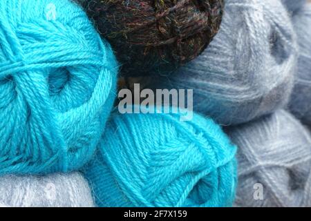 Knitting needles, colorful threads.  Knitting yarn for handmade winter clothes. Colorful background with yarn ball. Stock Photo