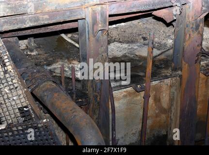 metal structure with pipes, destroyed and rusted after a fire Stock Photo