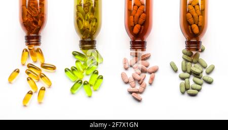 Different supplement pills with bottles on white background Stock Photo