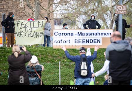 10 April 2021, Baden-Wuerttemberg, Heilbronn: 'Facts instead of conspiracy' is written on the banner of participants of a counter-demonstration directed against the demonstration of the initiative 'Querdenken'. The demonstration is directed against the pandemic restrictions of the federal government. Photo: Christoph Schmidt/dpa Stock Photo