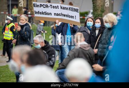 10 April 2021, Baden-Wuerttemberg, Heilbronn: 'A PCR test cannot detect an infection!' is written on the sign of a participant of a demonstration of the initiative 'Querdenken'. The demonstration is directed against the pandemic restrictions of the federal government. Photo: Christoph Schmidt/dpa Stock Photo