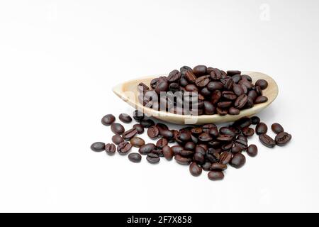 black coffee in beans in wooden dishes on a white background Stock Photo