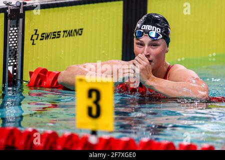 EINDHOVEN, NETHERLANDS - APRIL 10: Kim Busch competing in the Women 100m Freestyle during the Eindhoven Qualification Meet at Pieter van den Hoogenban Stock Photo