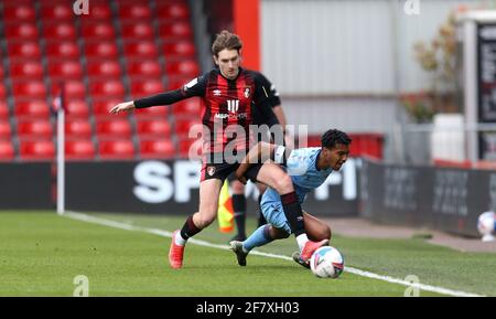 Coventry City's Sam McCallum (right) and AFC Bournemouth's David Brooks (left) battle for the ball during the Sky Bet Championship match at the Vitality Stadium, Bournemouth. Picture date: Saturday April 10, 2021. Stock Photo