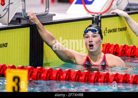 EINDHOVEN, NETHERLANDS - APRIL 10: Kim Busch competing in the Women 100m Freestyle during the Eindhoven Qualification Meet at Pieter van den Hoogenban Stock Photo