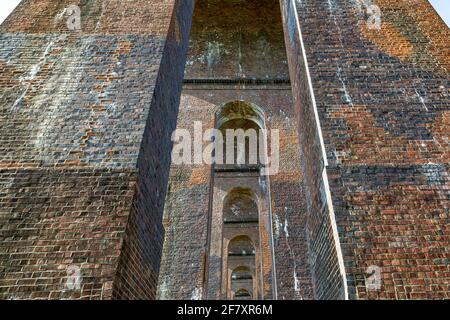 Looking up  through the arches at the Ouse Valley Viaduct in Sussex Stock Photo