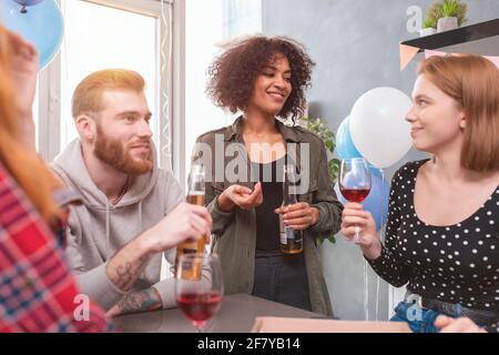 Festive party among multi-ethnic friends at home Stock Photo